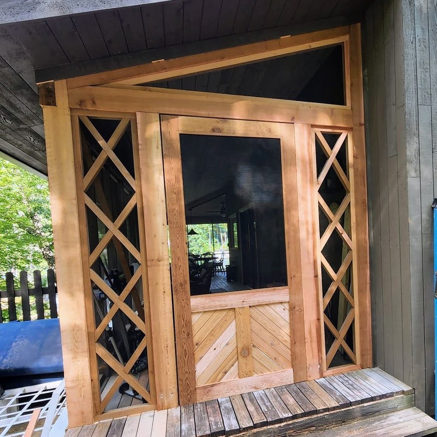Screened porch entry with a cedar frame and X-pattern side panels